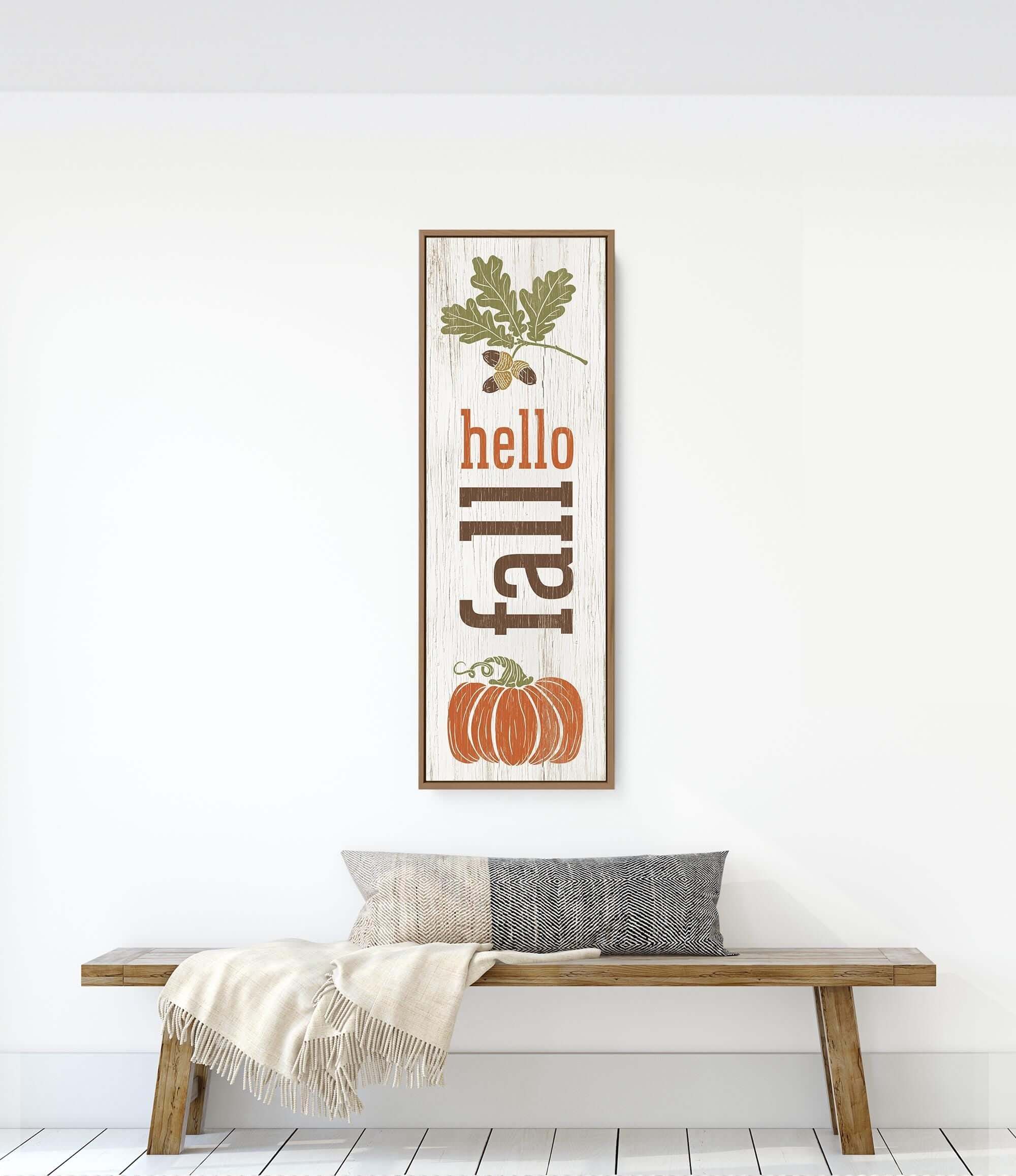 a wooden bench sitting in front of a white wall
