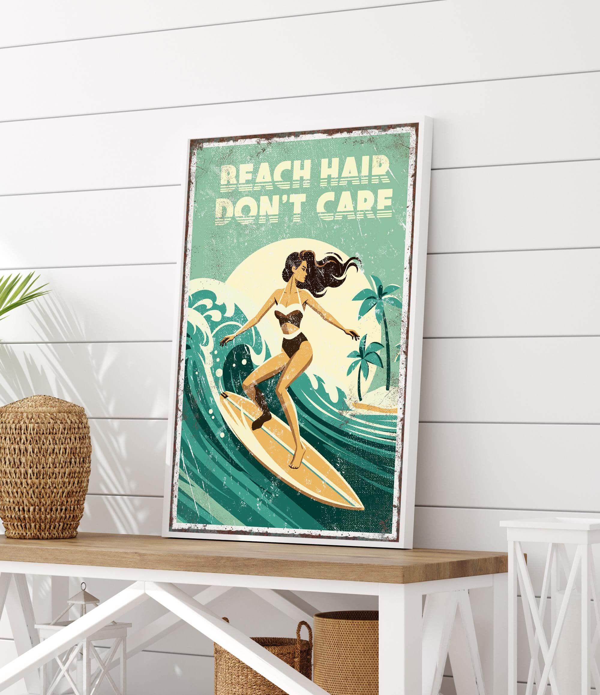 a framed poster with a woman surfing on a wave, along with the text "REACH HAIR DON'T CARE" written above the image.