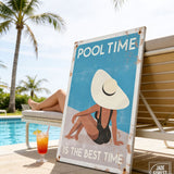 A vintage-style sign with a woman in a swimsuit and a large white hat, sitting on a bench near a pool, with a cocktail glass and a palm tree in the background.