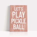 a wooden sign that says let's play pickle ball