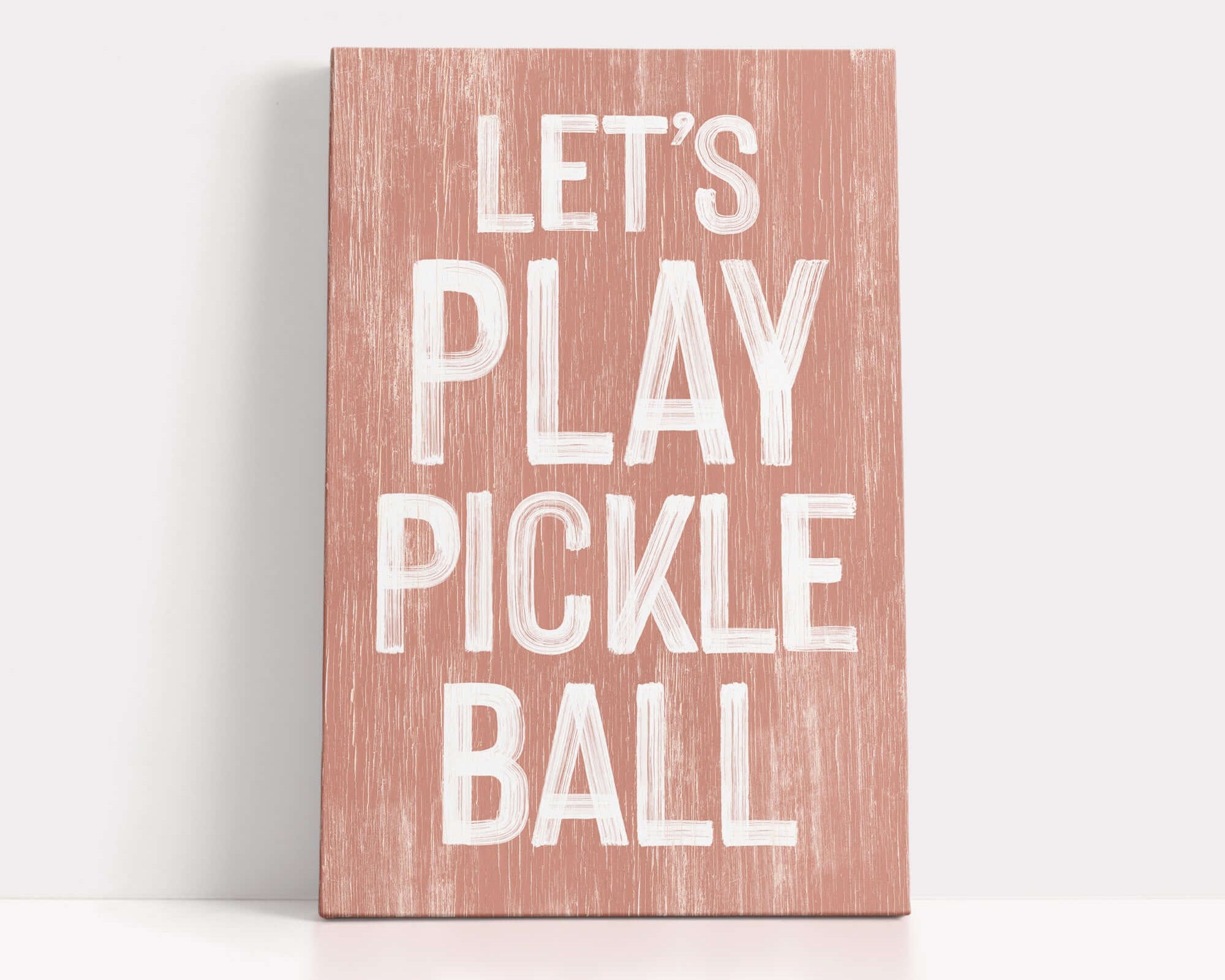 a wooden sign that says let's play pickle ball