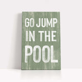 a green sign that says go jump in the pool