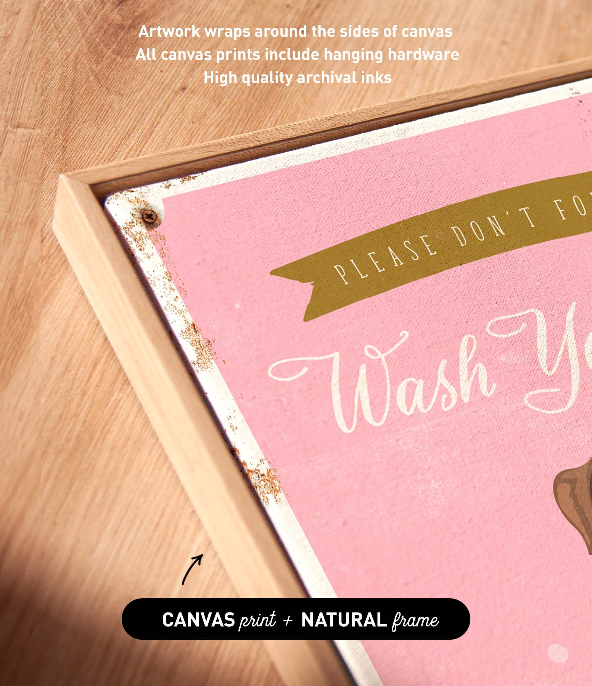 a pink canvas with the text "Please don't forget to wash your hands" written on it. The canvas is framed in a natural frame, and there is a small arrow pointing to the bottom right corner of the canvas.