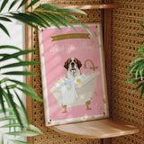 A framed poster with a dog sitting in a bathtub, surrounded by bubbles, and the text "Please don't forget to wash your paws" is displayed on a wall.