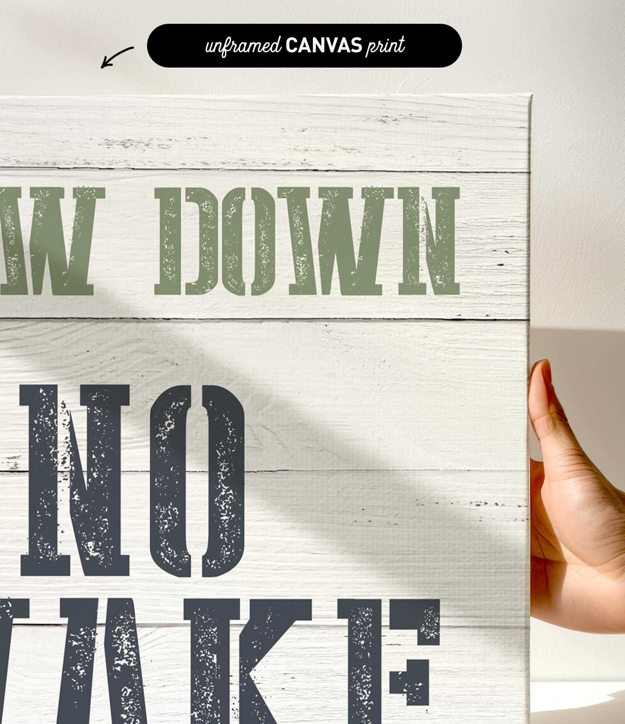 a hand holding a sign that says draw down no wake
