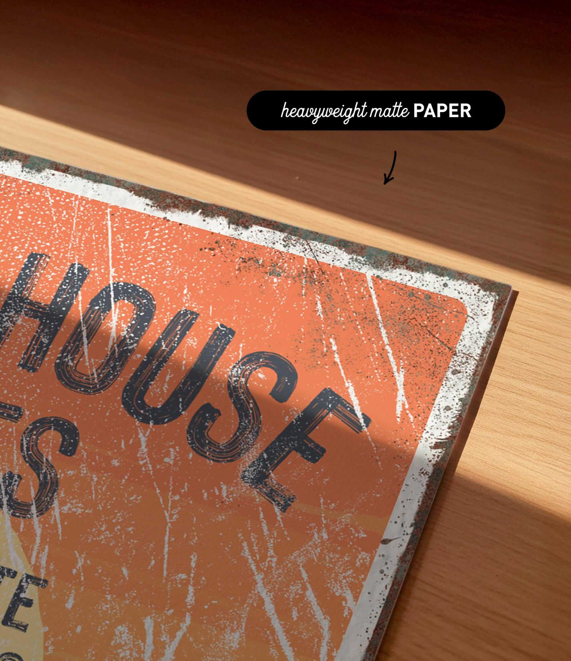 a close-up of a textured orange surface with the word "HOUSE" prominently displayed in large, bold letters.