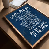 a blue sign sitting on top of a wooden table