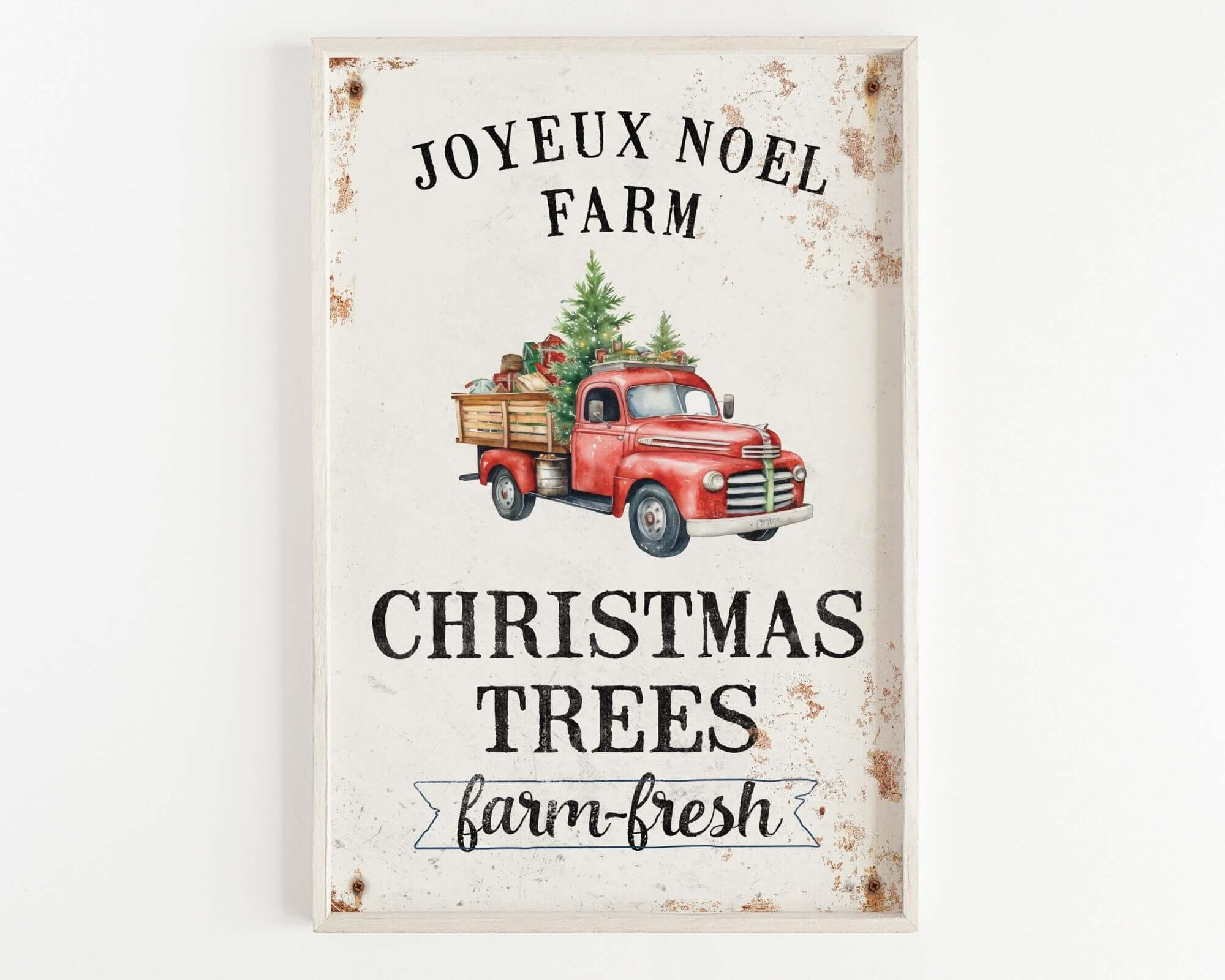 a red truck with a christmas tree on the back of it