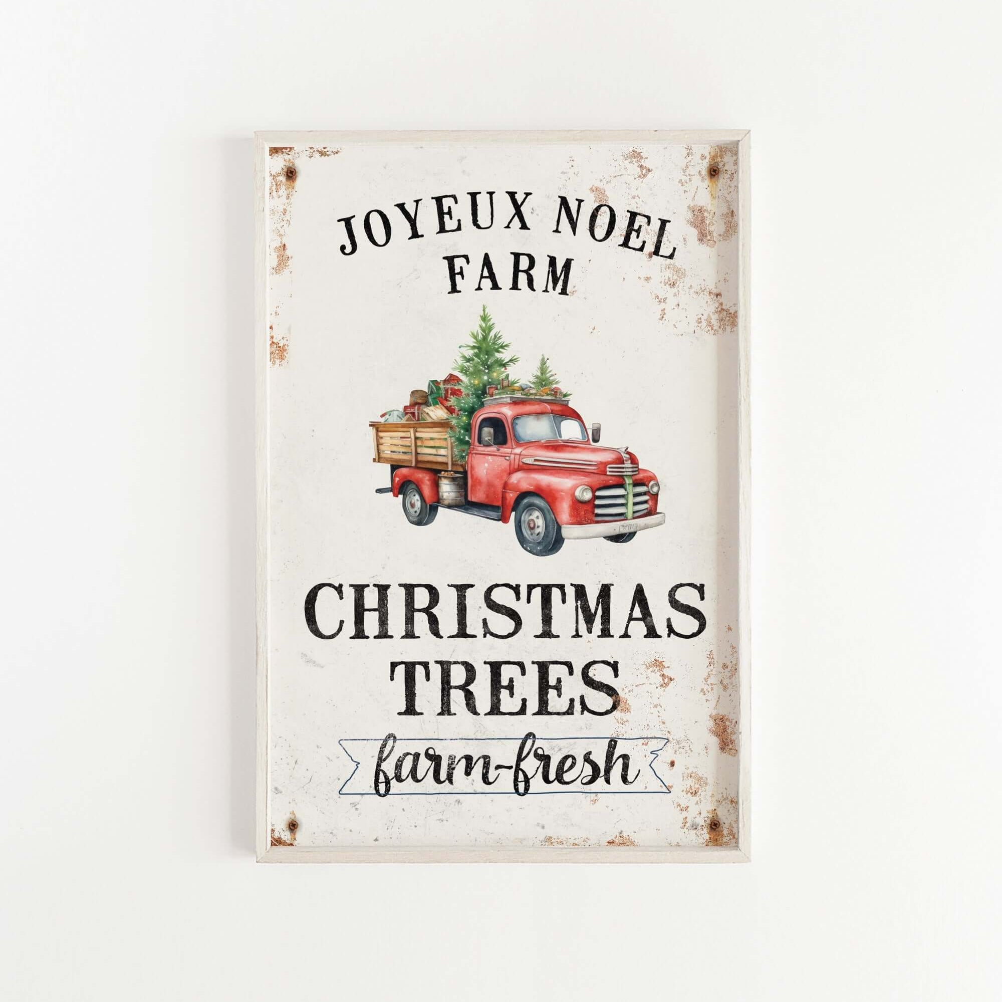 a red truck with a christmas tree on the back of it