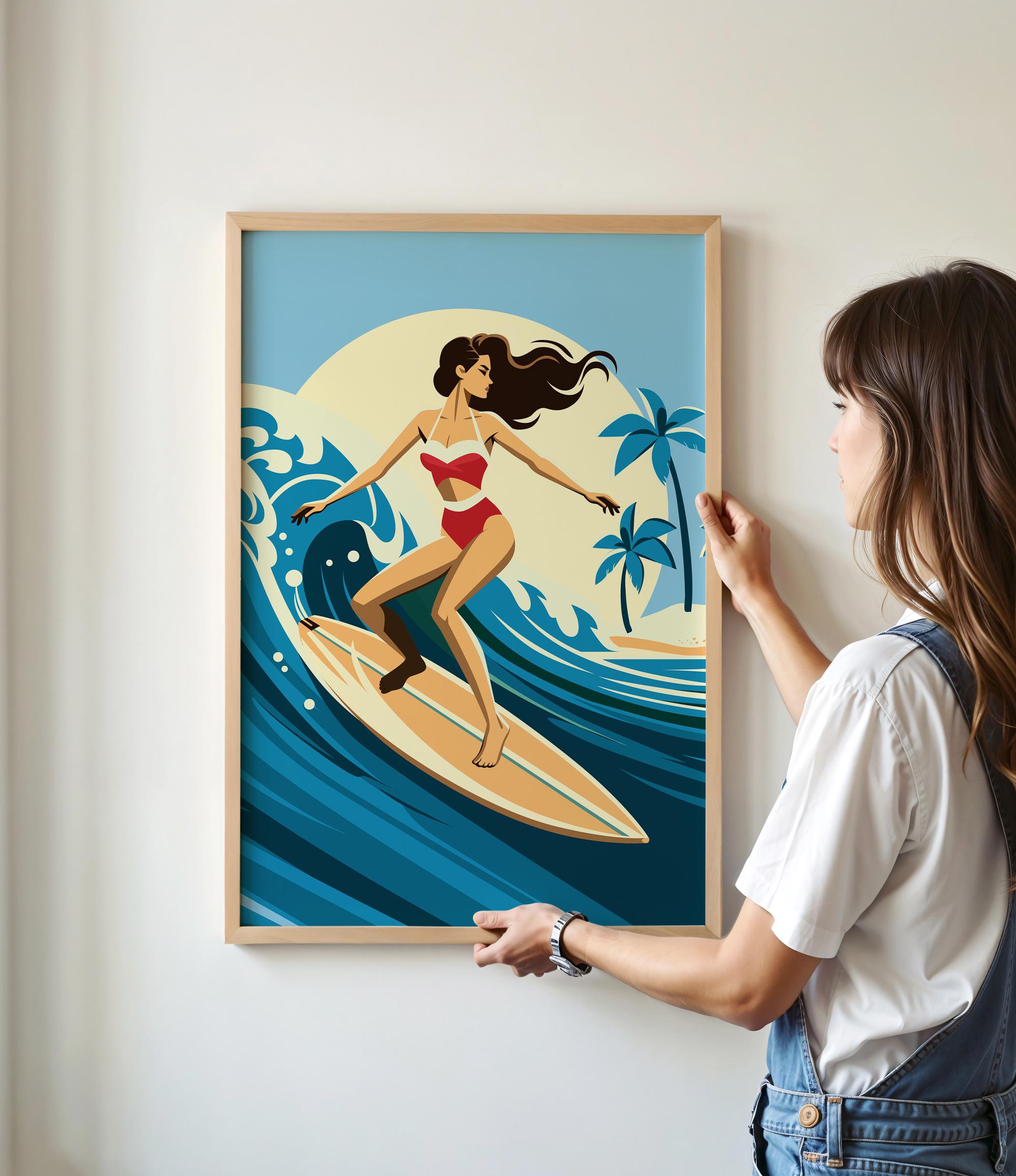 A woman is standing in front of a framed illustration of a woman surfing on a surfboard, with palm trees and a sunset in the background.