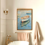 a bathroom with a white bathtub, a towel rack, and a framed painting of a boat on the wall.