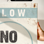 a hand holding a sign that says slow no wave