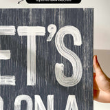 a person holding up a sign that says it&#39;s bona