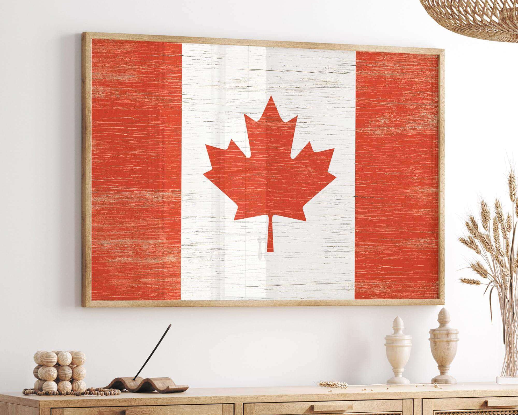 a picture of a canadian flag hanging on a wall