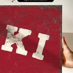 a close-up of a red, textured surface with a large white letter "K" prominently displayed.