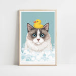 A framed illustration of a cat with a yellow rubber duck on its head, set against a light blue background with white bubbles.