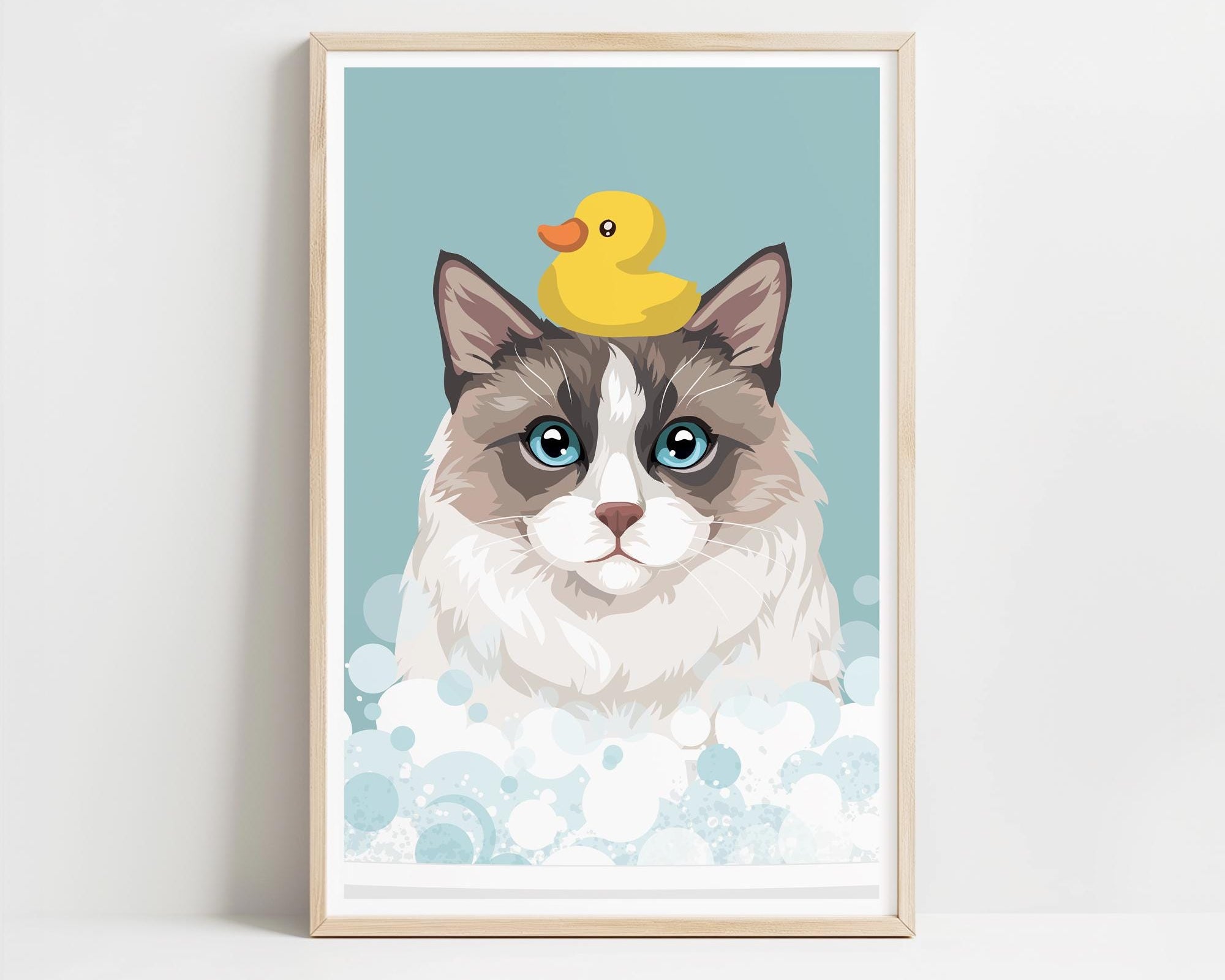 A framed illustration of a cat with a yellow rubber duck on its head, set against a light blue background with white bubbles.