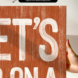 a person holding up a sign that says it&#39;s bona