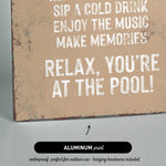 a sign that reads relax you&#39;re at the pool