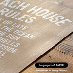 The image is a close-up of a textured surface with the text "Each house has rules" printed on it.