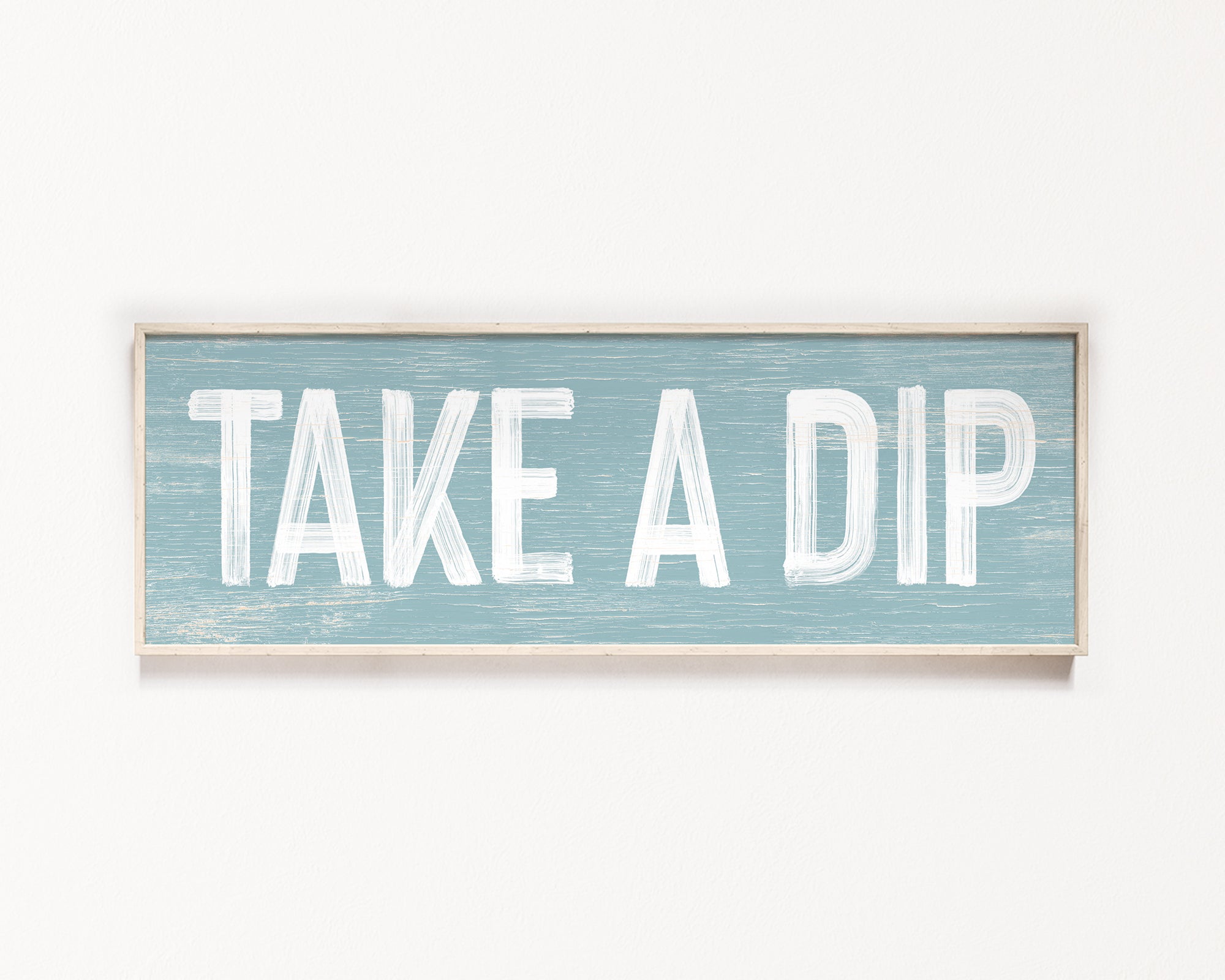 a wooden sign that says take a dip