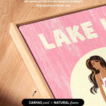 The image is a close-up of a framed artwork featuring a pink background with the word "LAKES" prominently displayed.