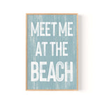 a blue and white sign that says meet me at the beach