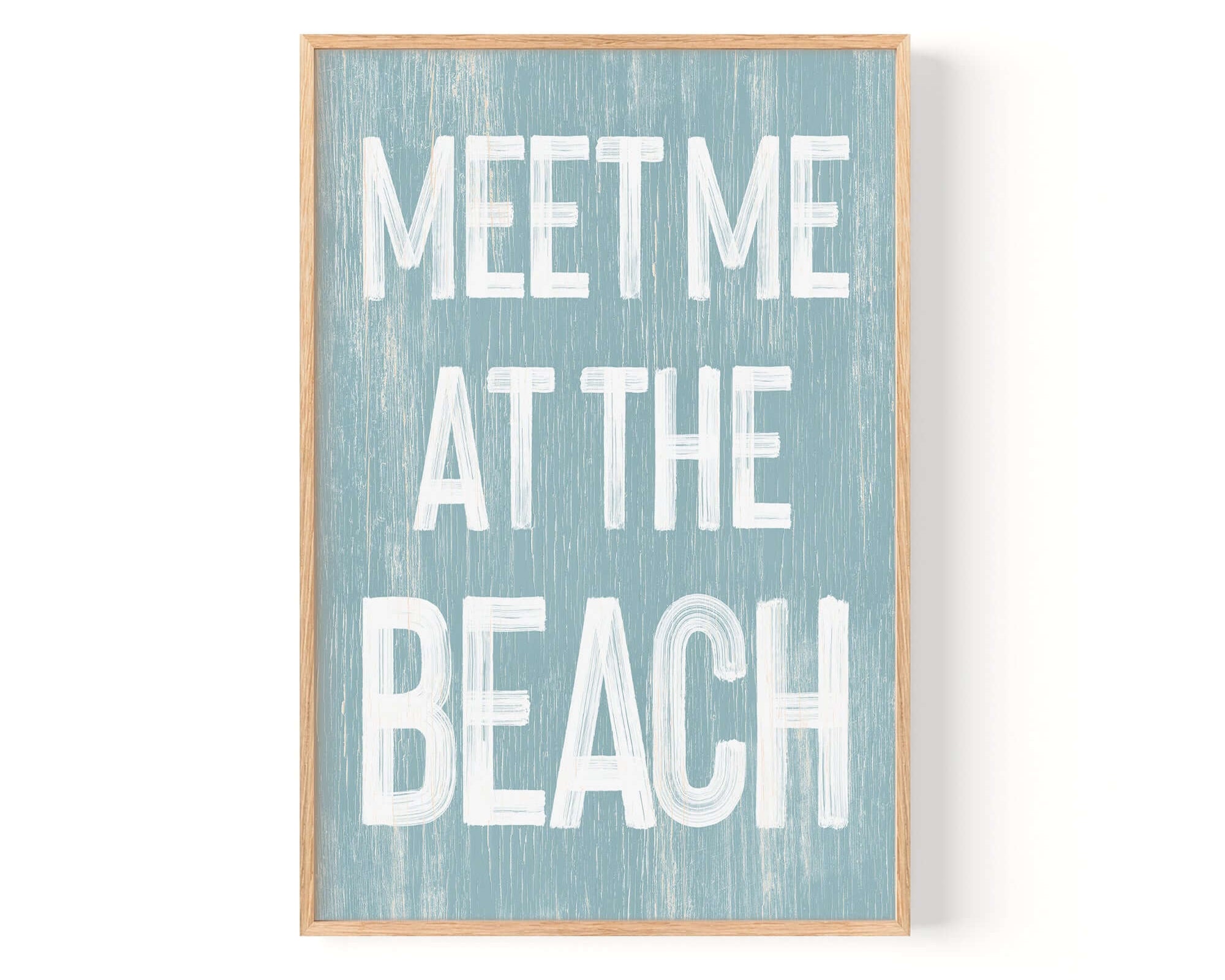 a blue and white sign that says meet me at the beach