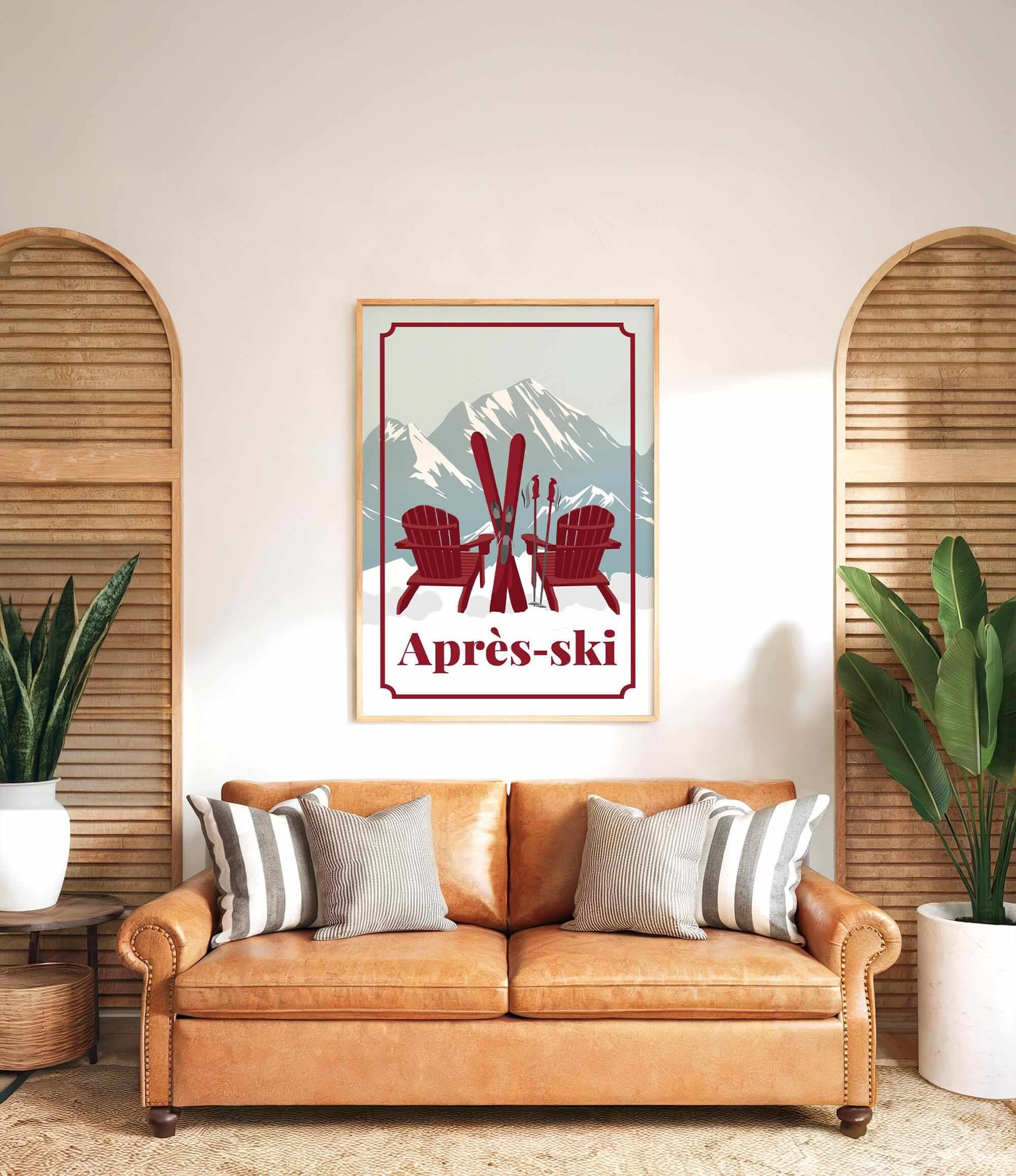 a cozy living room with a brown leather couch, a framed poster of a mountain landscape with ski equipment, and two potted plants on either side of the couch.