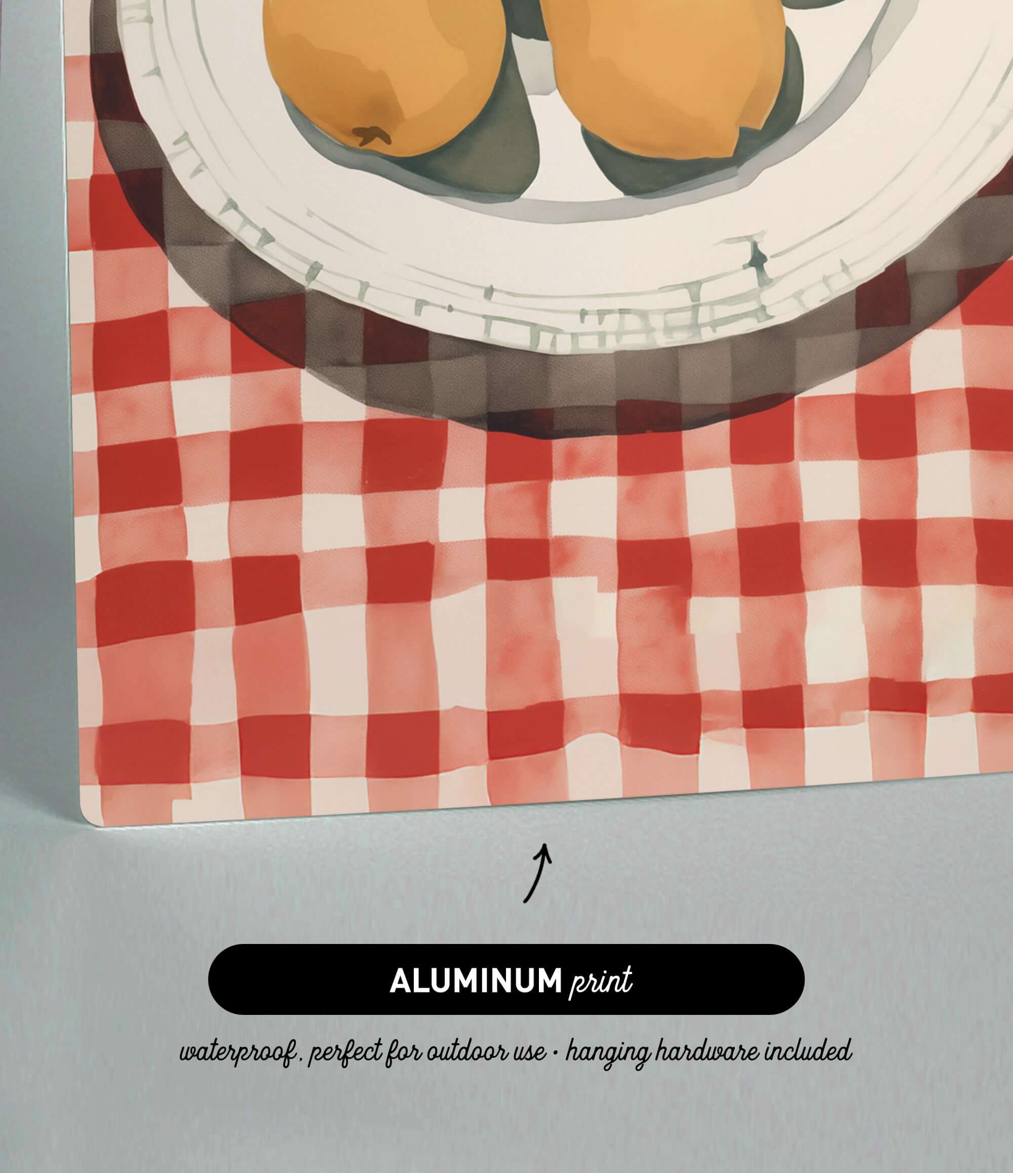 The image is an aluminum print depicting a plate with fruit on a red and white checkered tablecloth.