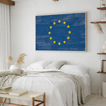 a bedroom with a bed and a painting on the wall