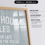 The image is a collage of various framed prints, including a large print of the phrase "HOUSES IN THE OCEAN UP LATE IN THE SUN" and a smaller print of "UP LATE IN THE OCEAN".