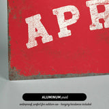 The image is an aluminum print with a red background and the word "APR" in white text.