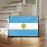 a picture of the flag of argentina on a wooden floor
