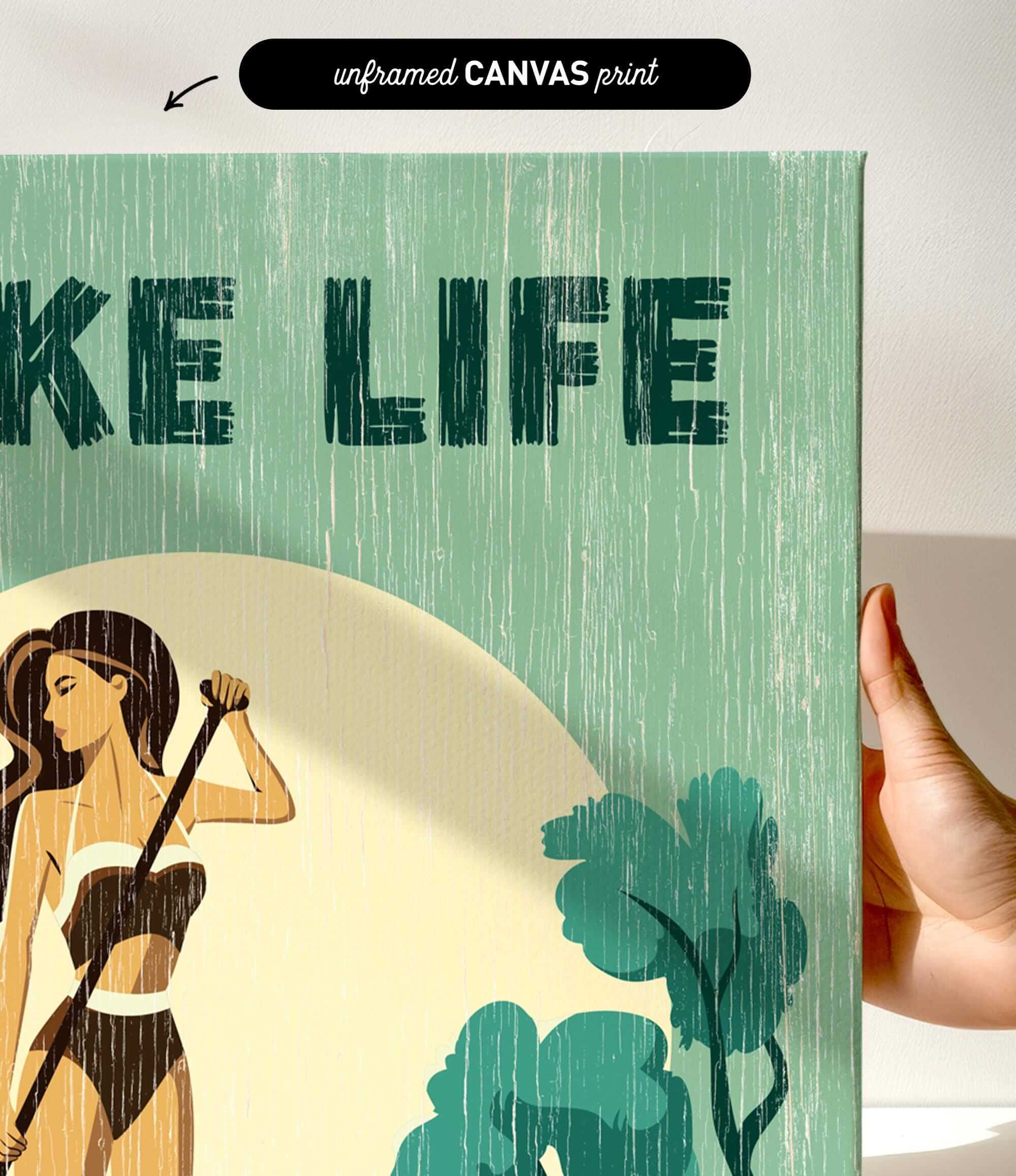 a hand holding a framed print with a green and yellow color scheme. The print has a textured appearance and includes a woman holding a cane.