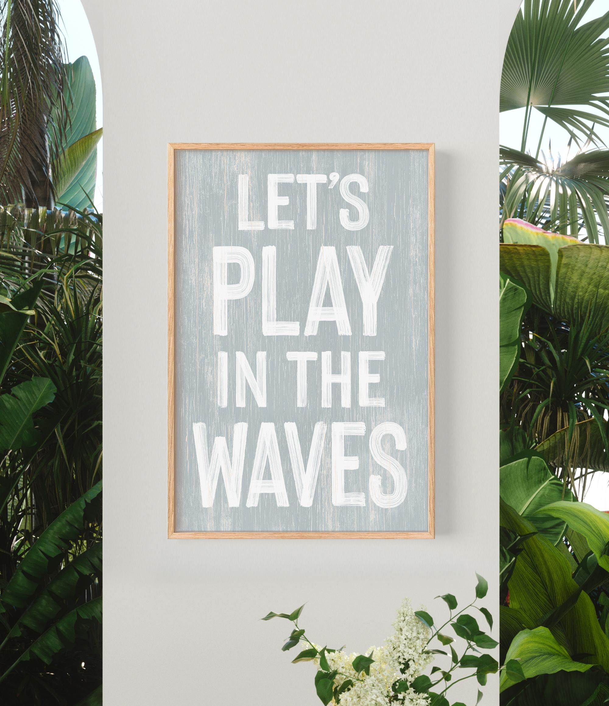 a sign that says let&#39;s play in the waves