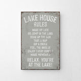 a metal sign that says lake house rules