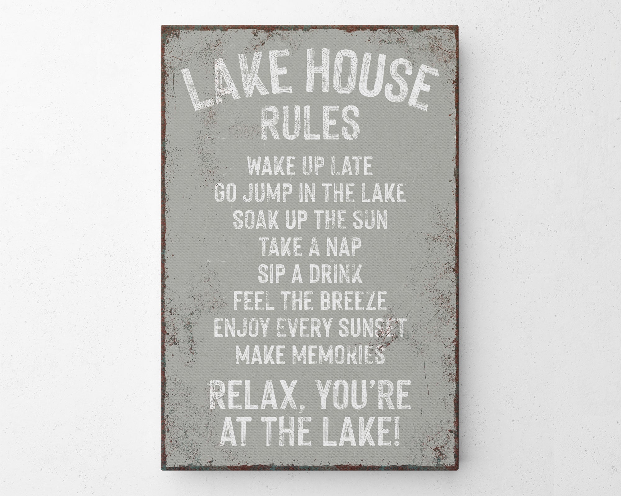 a metal sign that says lake house rules