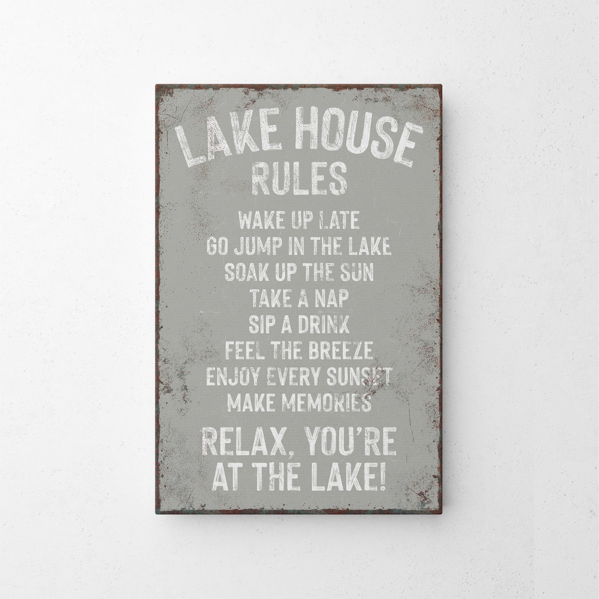 a metal sign that says lake house rules