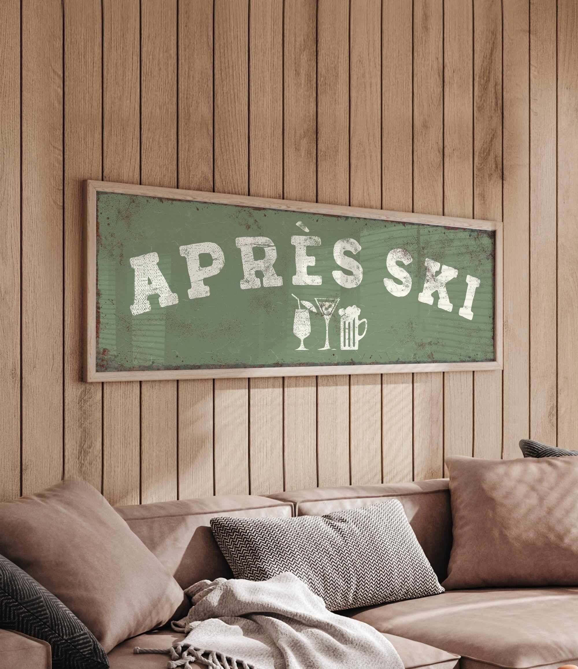 a cozy living room with a wooden wall and a green sign that reads "APRÈS SKI" in white letters. The sign also includes a beer mug and a wine glass, suggesting a festive or celebratory atmosphere.