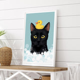 A framed illustration of a black cat with a yellow rubber duck on its head, set against a blue background with white bubbles.