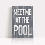 a wooden sign that says meet me at the pool