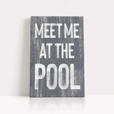 a wooden sign that says meet me at the pool