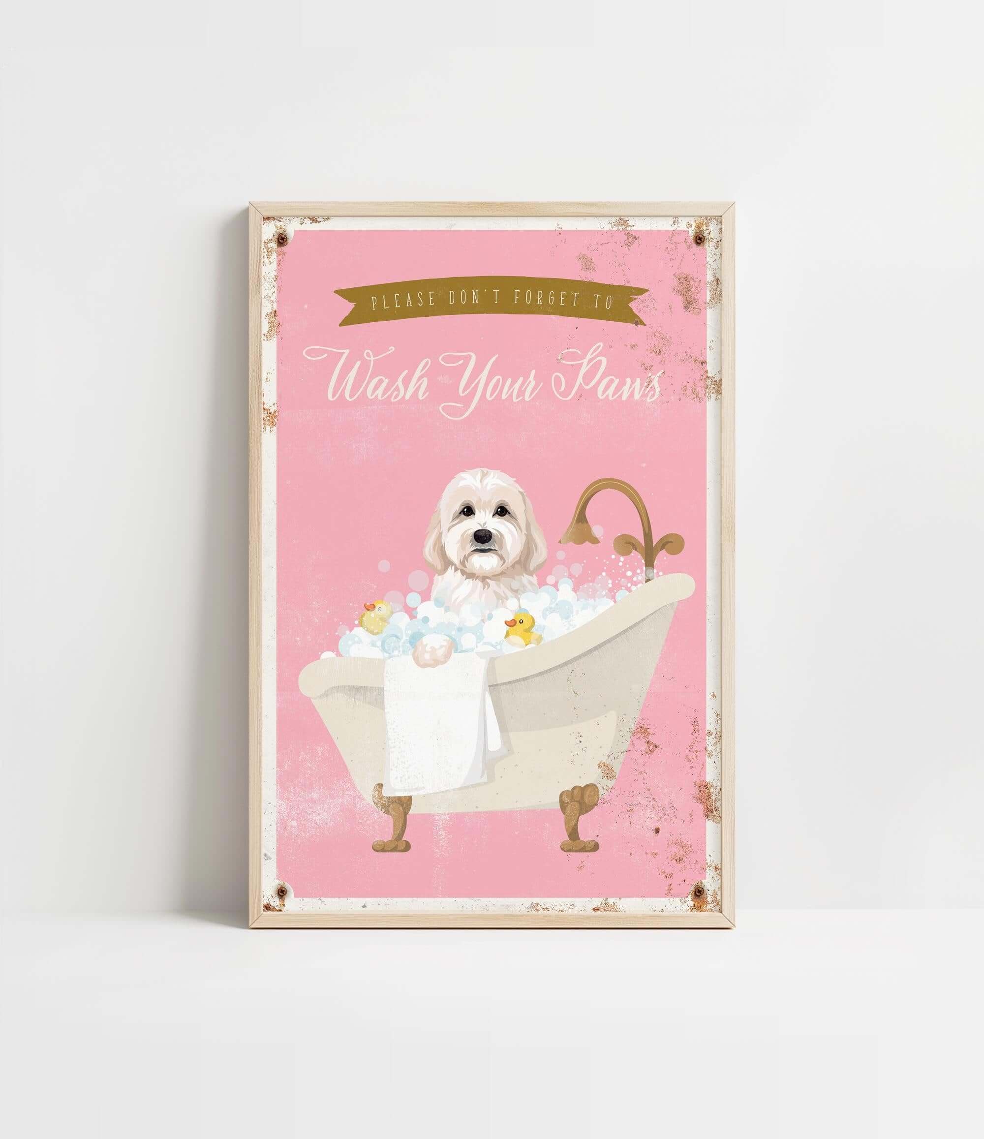 A framed poster with a cute white dog sitting in a bathtub filled with bubbles, accompanied by the text "Please don't forget to wash your paws".