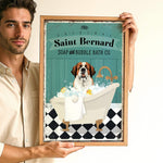 A man is holding up a framed advertisement for Saint Bernard Soap and Bubble Bath Co. featuring a dog sitting in a bathtub filled with bubbles.