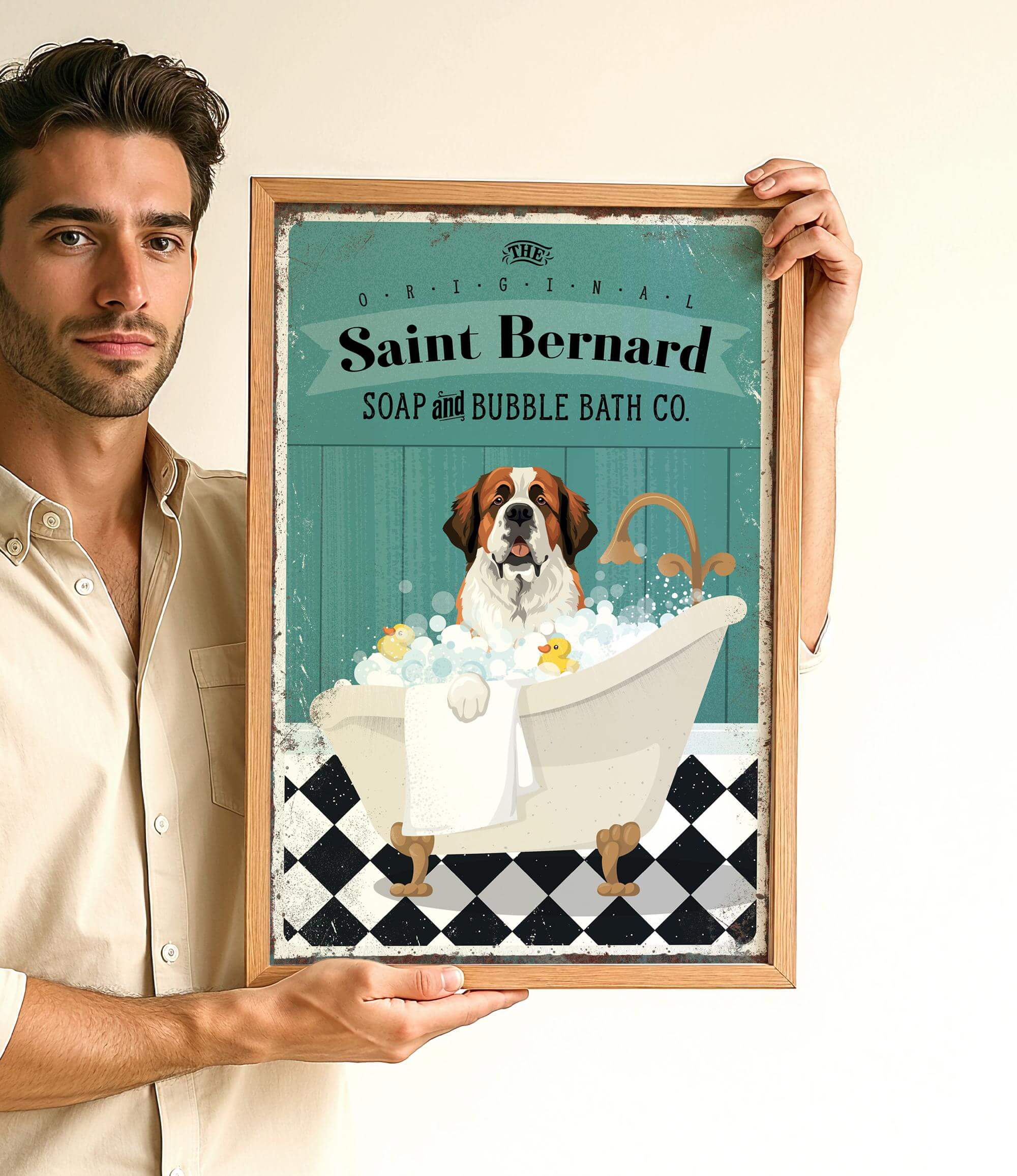 A man is holding up a framed advertisement for Saint Bernard Soap and Bubble Bath Co. featuring a dog sitting in a bathtub filled with bubbles.