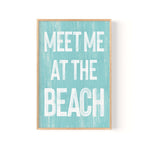 a blue and white sign that says meet me at the beach