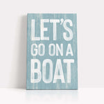 a wooden sign that says let&#39;s go on a boat