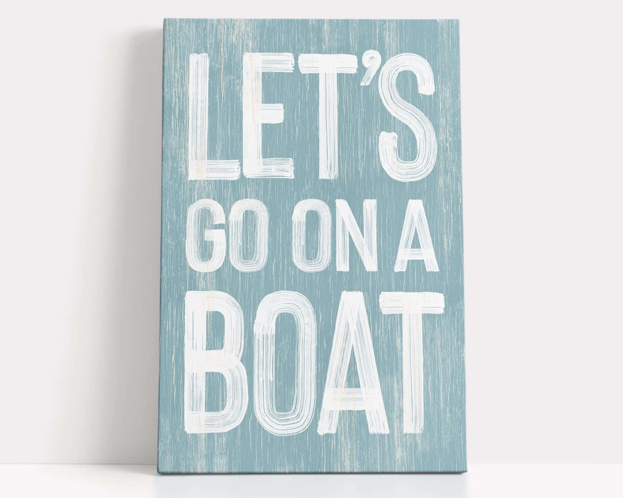 a wooden sign that says let's go on a boat