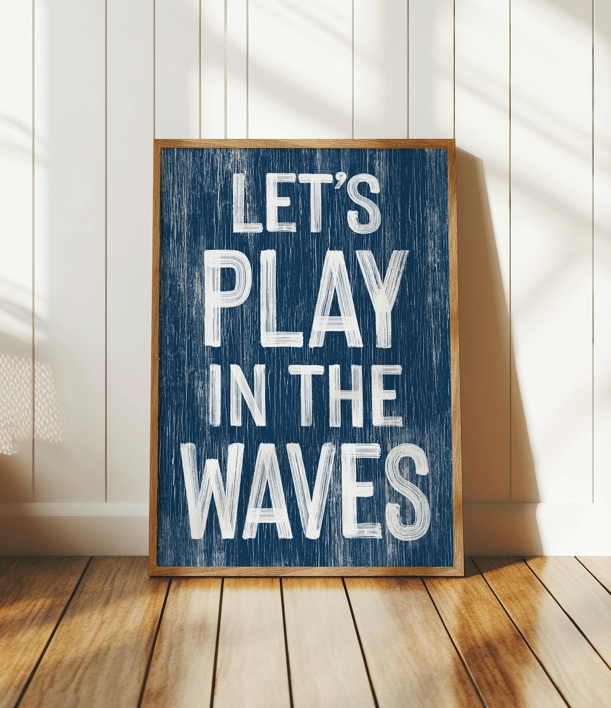 a wooden sign that says let&#39;s play in the waves